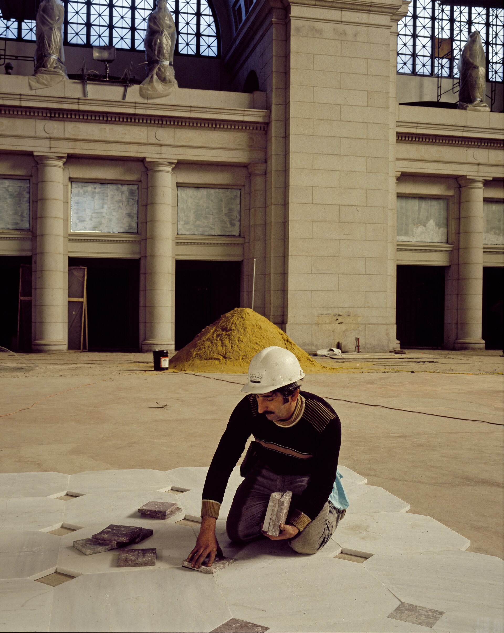 A craftsman setting stone during the restoration of Union Station, photographed by Carol M. Highsmith